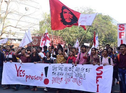 Jawaharlal Nehru University students march while holding a banner and chanting slogans during the rally in support of SFI candidates for upcoming elections in Jadavpur University in Kolkata.