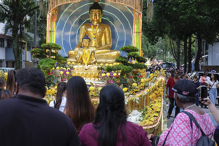 Buddhist devotees observe the decorated procession floats before the parades start during the Wesak day. Wesak Day or also known as Buddha Day, is one of the most important festivals for Buddhists in Kuala Lumpur and around the world. It marks the birth, enlightenment, and death of Gautama Buddha. In Kuala Lumpur, the celebration is both spiritual and colorful, attracting thousands of devotees and visitors. One of the highlights in KL is the Wesak Day procession. Beautifully decorated floats depicting scenes from the Buddha's life are paraded through the streets. Overall, Wesak Day in Kuala Lumpur is a meaningful celebration that unites the community in reflection and peace.
