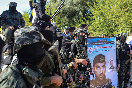 Members of Saraya al-Quds, the military wing of the Islamic Jihad movement in Palestine, take part in a rally in Beit Hanun, northern Gaza Strip, marking the first anniversary of May 2021 conflict between Israel and Gaza.