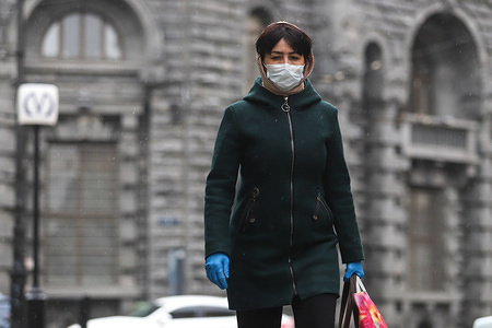 A woman wearing a face mask and gloves as a precaution against the spread of coronavirus walks along the subway.
Russian Prime minister Mikhail Mishustin limits sales of certain medical products. Only pharmaceutical companies get right to sell masks, respirators and gloves.