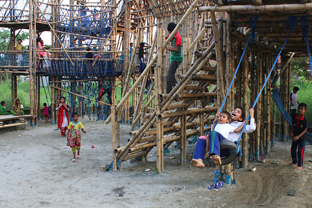 Children play inside the bamboo play space in Dhaka.
The unique play space built in Dhaka has brought smiles on the faces of local and underprivileged children. It is eco-friendly and affordable. This play space was built by a charity organization which is working on underprivileged children.