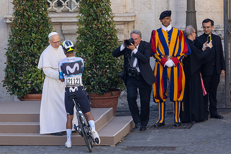 Pope Leo XIV greets cyclists of the Giro d’Italia race as they passed through Vatican City.
