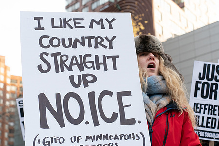A woman holds a sign that reads "I like my country straight up. No. ICE" during a protest at Union Square against Immigration and Customs Enforcement (ICE) on Saturday, January 24 2026 in New York, New York, USA following the deadly shooting of Alex Jeffrey Pretti in Minneapolis, Minnesota earlier the same day.