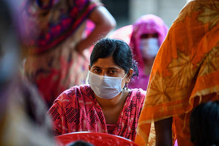 A sex worker seen waiting to get inoculated with the Sinopharm vaccine against the Covid-19 coronavirus during a special vaccination drive at Daulatdia outskirt of Dhaka.