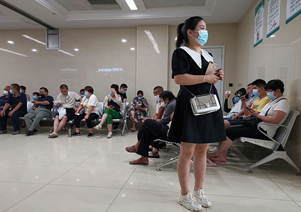 A woman looks on while wearing a face mask as a preventive measure against the spread of Coronavirus (COVID-19) at Fuyang City People's Hospital.
China has so far confirmed 84,337 coronavirus cases, 4,634 deaths and 78,989 recovered.