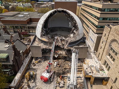 (EDITOR'S NOTE: Image taken with drone)
 A drone photo shows a Priestly Demolition (PDI) high-reach excavator systematically dismantling the concrete shell of the historic McLaughlin Planetarium at the University of Toronto. The McLaughlin Planetarium is being demolished to clear the site for a new six-storey University of Toronto educational hub known as the Centre for Civilizations, Cultures, and Cities. This new facility will primarily house the School of Cities and include academic spaces for various faculties, along with a world-class recital hall.