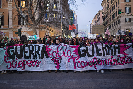 Protesters march with a huge banner expressing their opinion, during the Women's march to celebrate International Women's Day in Rome.
People displayed placards and banners demanding and supporting women rights.