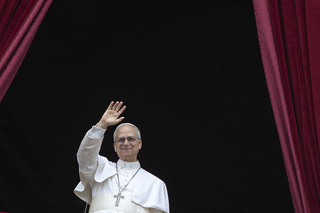 Pope Leo XIV waves to the faithful from the Central balcony of St. Peter's Basilica at the Vatican.