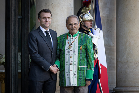 Emmanuel Macron (L), France's President, welcomes José Ramos-Horta (R), the President of the Democratic Republic of Timor-Leste, at the Elysee Presidential Palace.