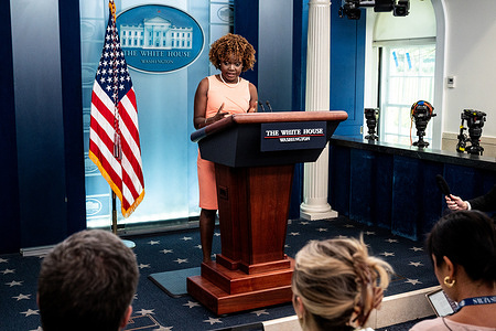 White House Press Secretary Karine Jean-Pierre speaking at a press briefing in the White House Press Briefing Room.