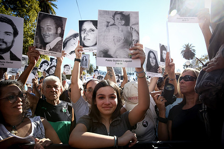 Protesters hold portraits of the disappeared during the National Day of Memory, Truth and Justice. Tens of thousands of Argentines filled the streets of Buenos Aires and cities across the country to mark the 50th anniversary of the 1976 military coup that led to a seven-year dictatorship. During the National Day of Memory for Truth and Justice, participants wore A4-sized portraits of the disappeared (desaparecidos), making visible the estimated 30,000 victims. The mass gathering at Plaza de Mayo saw protesters chant “Nunca Más” (“Never Again”) and call for the military to reveal the fate of those still missing.