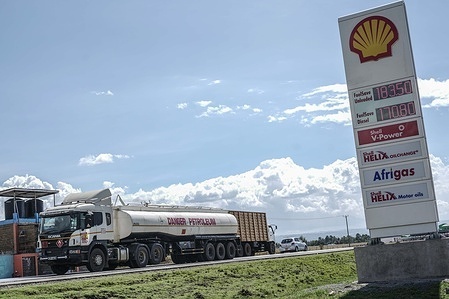 An oil tanker drives past a Shell oil price signboard. Despite falling global crude prices, fuel costs in Kenya remain unchanged leaving motorists and households under continued strain.