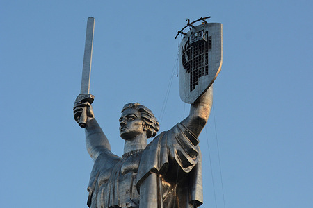 A dismantled State Emblem of the Soviet Union on the shield of the Motherland Monument at the National Museum of the History of Ukraine in WWII Memorial Complex in Kyiv. Workers dismantled the State Emblem of the Soviet Union on the shield of the Motherland Monument as part of the decommunization in Ukraine. The Soviet symbol will be replaced by the Ukrainian Tryzub today in Kyiv.