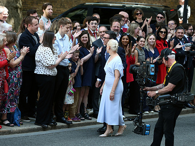 New Prime Minister and Leader of the Labour Party Andy Burnham and wife Marie France van Heel greet supporters as they arrive at Downing Street.