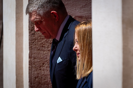 Italian Prime Minister Giorgia Meloni and the Slovak Prime Minister Robert Fico review the honor guard before a meeting at Palazzo Chigi.
