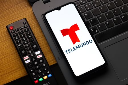 In this photo illustration, the Telemundo logo is seen displayed on a smartphone screen.