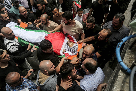 (EDITOR'S NOTE : Image depicts death) 
Palestinians carry the body of Jassem al-Sada, 25-years old during his funeral. Jassem was killed during an Israeli military raid on his home in the village of Jit, east of Qalqilya, in the West Bank. Al-Sada's family said the Israeli army shot him four times while he was sleeping in his bed.