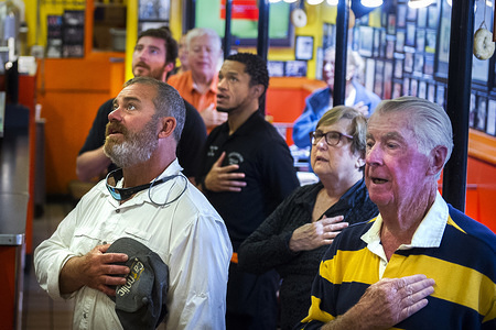 On the 16 year anniversary of the terrorist attacks of September 11, 2001, employees and customers stand for the daily Pledge of Allegiance at Chick & Ruth's Delly. Minutes after the Pledge of Allegiance was being recited in this mom and pop restaurant 16 years ago, the first plane had crashed into the north tower of the World Trade Center in New York City, and the rest of the terrorist attacks upon the United Stated were under way. Chick & Ruth's Delly owner Ted Levitt began holding the Pledge of Allegiance in his small diner in 1989.