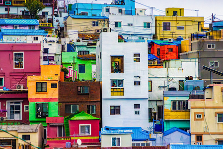 A general view of Gamcheon Culture Village in Busan, South Korea, shows rows of colorful houses stacked along the hillside. Originally a settlement for Korean War refugees in the 1950s, the area was transformed into a cultural and artistic landmark through a 2009 urban regeneration project. Today, the village draws thousands of tourists yearly who see its unique blend of history, culture, and creativity.