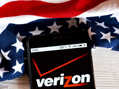 In this photo illustration a Verizon Communications logo is seen displayed on a smartphone.