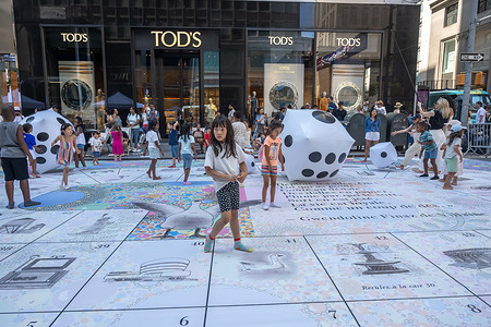 Children play during the annual Bastille Day celebration on Madison Avenue.