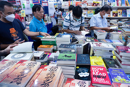 Visitors seen checking out books on display during the Book Expo Thailand 2025 at the Queen Sirikit National Convention Center.