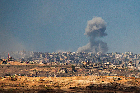 Gaza Strip as seen from the Israeli border, Smoke billowing from the ruins of Gaza City following Israeli airstrikes.