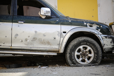 A damaged car seen next to Israeli targeted residential building in central Gaza City.
The Israeli air force has carried out a large scale air strike to Gaza city destroying many commercial and residential buildings.