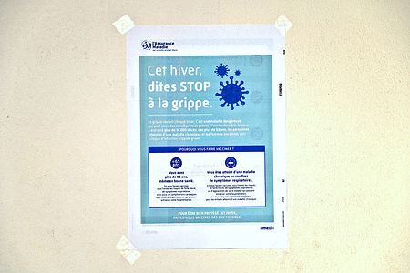 A poster for flu vaccination seen displayed on a wall. French MPs in the Social Affairs Committee have adopted the creation of a legal basis for mandatory flu vaccination for residents of nursing homes and certain healthcare professionals.