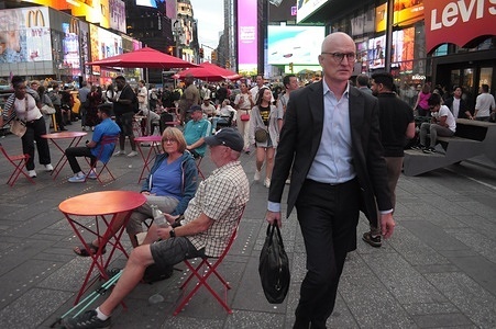 People walk in Times Square, Manhattan, New York City.
