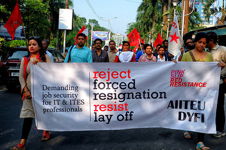 Protesters march with a banner during the demonstration.
More than a hundred IT ( (Information Technology) employees and several DYFI ( Democratic Youth Federation of India) activists protested at the IT hub of Kolkata- Sector 5 against what they claimed was the illegal and unethical mass retrenchment in the IT industry.