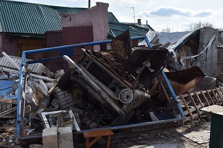 A destroyed car seen at the backyard of a private house that was heavily damaged by Russian shelling in Huliaipole. Huliaipole is situated on the frontline of the war. Residents of Huliaipole have been living under constant shelling for two years now. Once a cozy city with thousands of people, with picturesque views, resembles a wasteland. You will hardly meet people on the streets - there are only one and a half thousand of them left here.