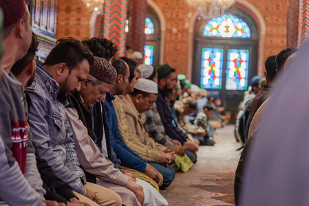 Kashmiri Muslims pray inside a shrine on the first Friday, second day of Islamic month Ramadan in Srinagar.