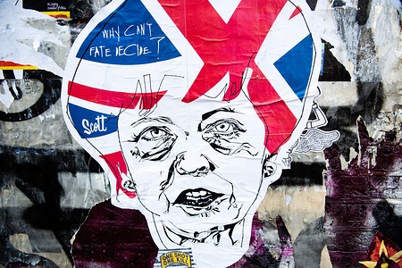 A sticker of Theresa May is seen on a wall.
As the Brexit deadline looms, new murals and paste-ups appear on the streets of London. Brick Lane, in London's east end, is one of the most popular places to find all kind of art around the Brexit. Also in the famous district of Shoreditch, tourists walk and take photos around this political street art.