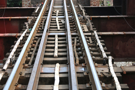 Bamboo was used instead of iron on the railway tracks in a section of a railway bridge in Dhaka. 
This is a high-risk factor for the train commuters.