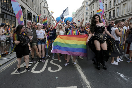 Participants pose for a photo while holding a flag during the Pride.
Thousands of revellers filled London’s streets with colour to celebrate Pride in the capital city. 2019 marked the 50th anniversary of the Stonewall riots in New York City, seen as the origin of Pride and the LGBT+ rights movement.