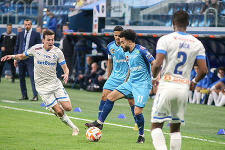 Claudio Luiz Rodrigues Parise Leonel, commonly known as Claudinho (No.11) of Zenit and Eli Dasa (No.2), Denis Makarov (No.25) of Dynamo in action during the Russian Premier League football match between Zenit Saint Petersburg and Dynamo Moscow at Gazprom Arena. Zenit 3:1 Dynamo.