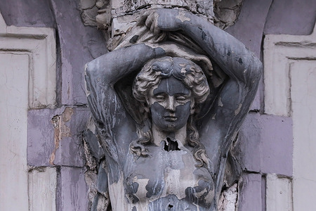 A view of a female bas-relief sculpture on one of the buildings along the Griboyedov Canal in St. Petersburg.