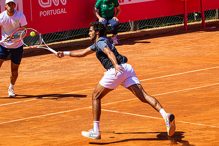 Francisco Cabral of Portugal plays against Sam Weissborn of Austria and Romain Arneodo of Monaco during the 1st round of the Millennium Estoril Open tournament at CTE- Clube de Ténis do Estoril. 6-3, 7-6(3) victory against Romain Arneodo and Sam Weissborn.