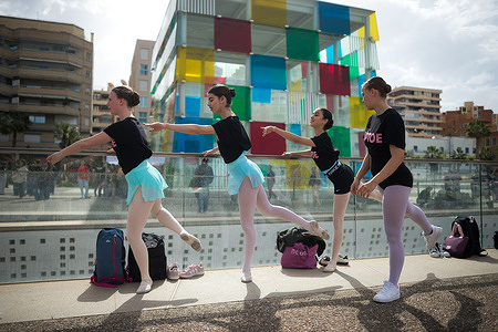 Dancers are seen rehearsing before taking part in a ballet performance at Muelle Uno square. As part of the first edition of the Soho International Dance Festival, around 600 dancers have performed a classical ballet choreography directed by the dancer Lucia Lacarra. TIP TOE, Soho International Dance Festival, is a new festival produced by the CaixaBank Soho Theatre, run by the Spanish director and actor Antonio Banderas.
