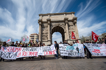 Protesters hold a large banner in front of "La Porte d'Aix" during a demonstration. Between 10,000 (according to the police) and 160,000 (according to the organisers) people took part in the 11th march in Marseille to protest against the pension reform and the use of article 49.3 of the constitution to impose it without a vote of the parliament.