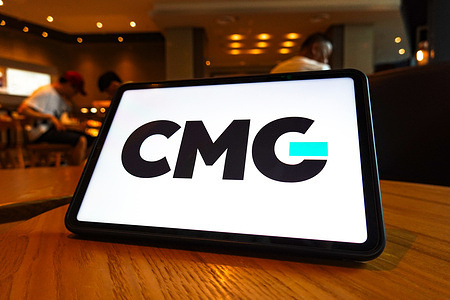In this photo illustration, the CMG logo is displayed on the screen of a tablet.