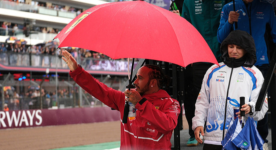 Lewis Hamilton of Scuderia Ferrari F1 Team is seen during the Formula One British Grand Prix at Silverstone. Lando Norris of McLaren F1 Team, winner of the British Grand Prix.