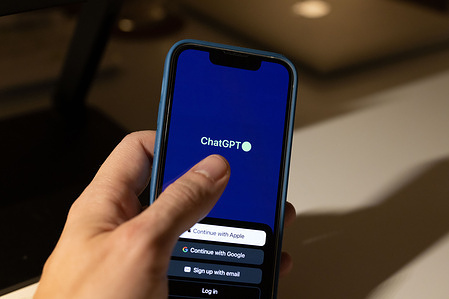 In this photo illustration, a ChatGPT iOS App logo displayed on a smartphone.