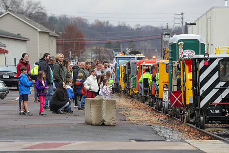 People gather along the North Shore Railroad to donate toys to Toys for Tots. Members of the North American Railcar Operators Association (NARCOA) participated in the 22nd annual Larry Maynard Toys for Tots Ride from Northumberland to Berwick.