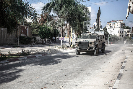 An Israeli military vehicle seen during a raid on the Tulkarm Palestinian refugee camp in the occupied West Bank. During a raid launched by Israeli army forces, three Palestinian militants were killed during a drone air strike, and the Ministry of Health announced that a girl was killed during the military operation.