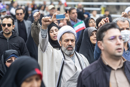 Protesters march through Tehran during the yearly rallies marking the anniversary of the victory of the 1979 Islamic Revolution in Iran.