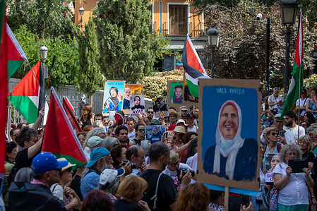 A group of people hold placards during the demonstration. A demonstration is held in the Malasaña neighborhood to raise their voices for all the Palestinian women in Gaza who are resisting bombing and blockade.