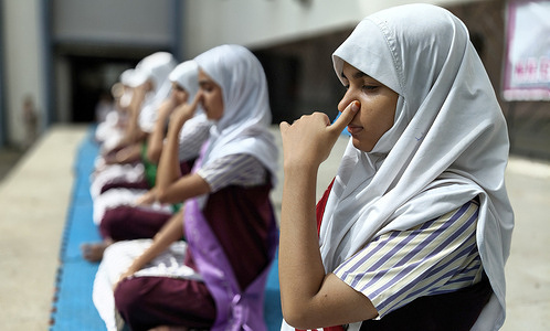Students from N.H English Academy school participate in a yoga session conducted on the occasion of International Yoga day. Practising regular yoga exercise from a very young age yields significant benefits in reducing stress and anxiety promoting physical health and mental well being which in turn brings joy, happiness and peace of mind.