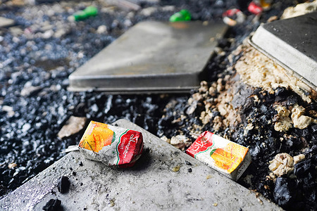 Boxes of juice are seen at the site of a fire that broke out on Thursday night at Hashem Foods Ltd factory in Rupganj, Narayanganj district, on the outskirts of Dhaka.At least 52 people have been found dead, 25 others injured and many are feared trapped after a massive fire raged through a factory, the cause of the fire which originated at a ground floor of a multi storey building of the factory is not yet known.